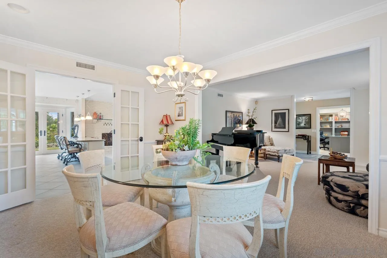 1346 El Nido Drive Fallbrook, CA 92028 - Photo 12 of 75 a dining room with furniture a kitchen and chandelier
