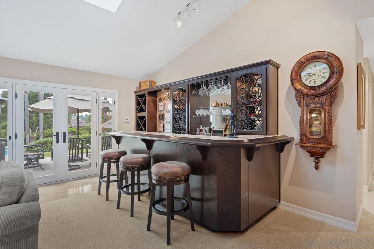 1346 El Nido Drive Fallbrook, CA 92028 - Photo 15 of 75 a living room with furniture a clock and a large window