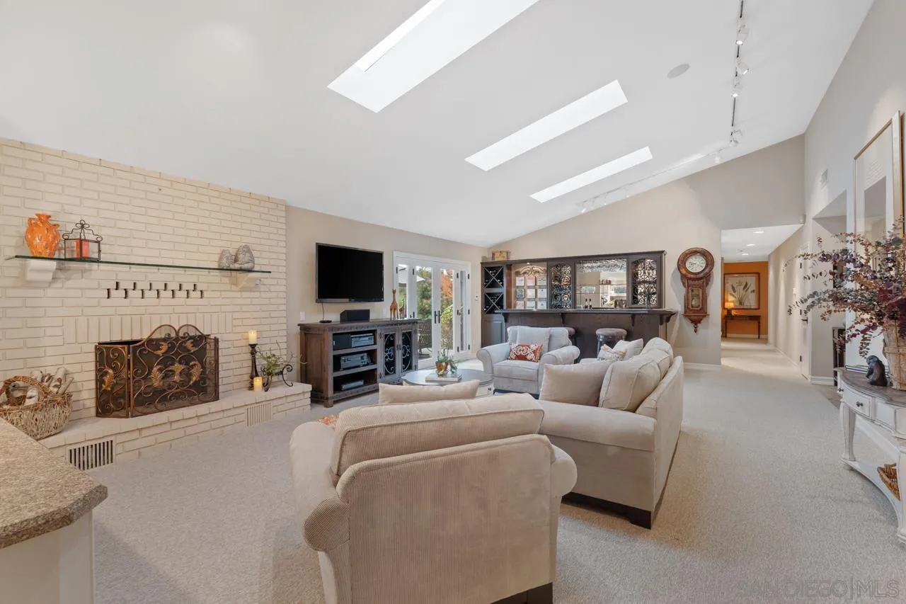 1346 El Nido Drive Fallbrook, CA 92028 - Photo 18 of 75 a living room with furniture a fireplace and a flat screen tv