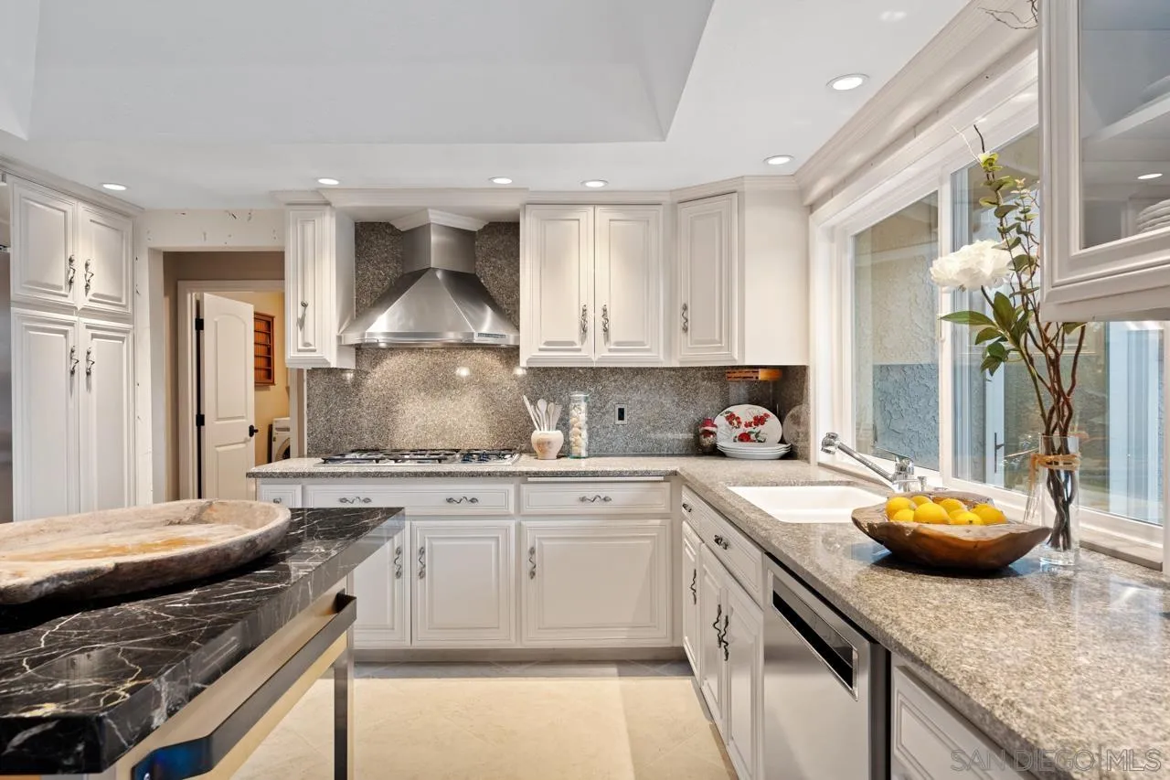 1346 El Nido Drive Fallbrook, CA 92028 - Photo 26 of 75 a kitchen with stainless steel appliances granite countertop a sink stove and cabinets