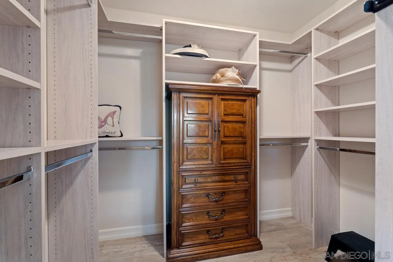 1346 El Nido Drive Fallbrook, CA 92028 - Photo 29 of 75 a view of walk in closet with clothes and shoes