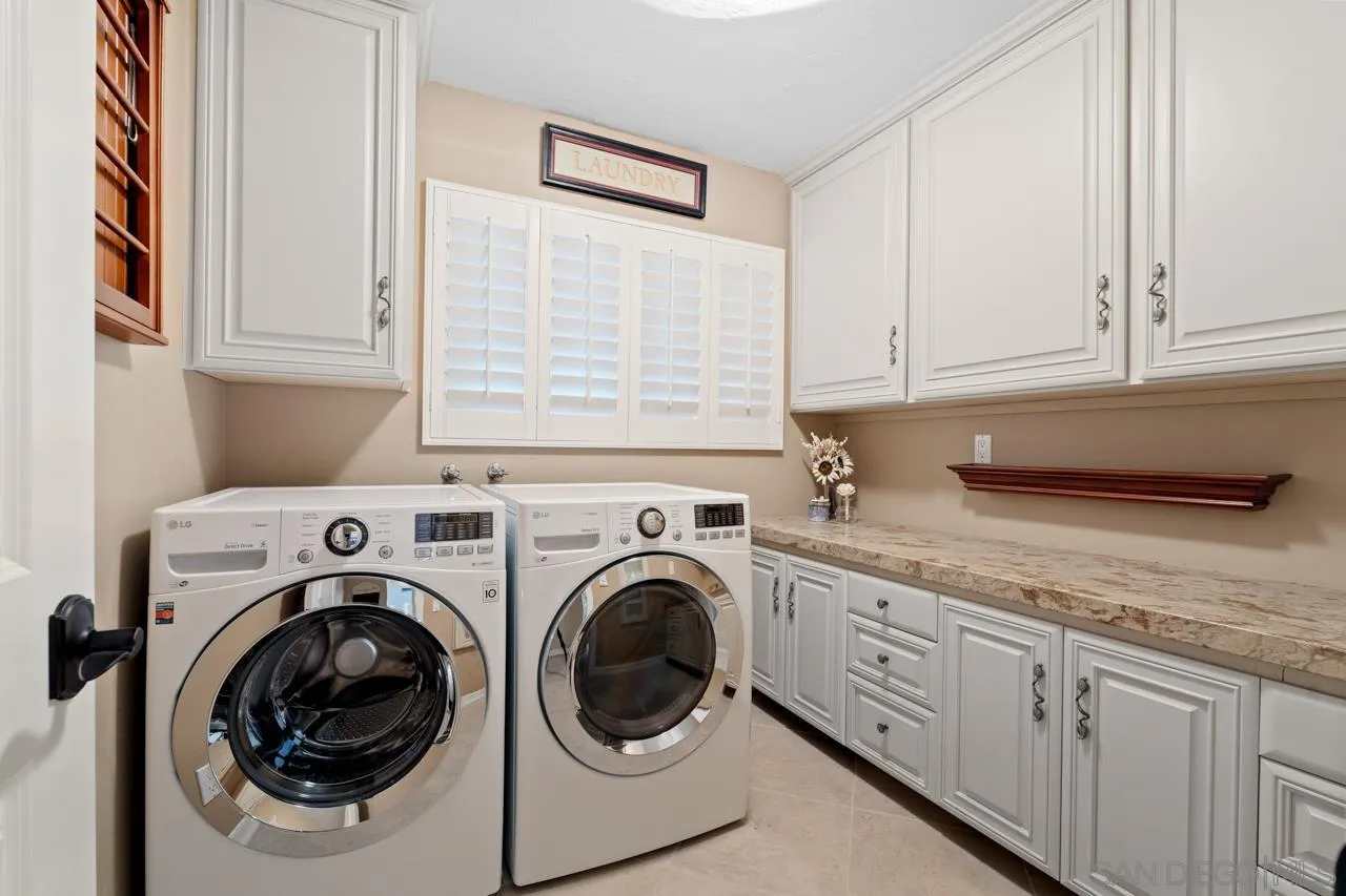 1346 El Nido Drive Fallbrook, CA 92028 - Photo 37 of 75 a utility room with sink dryer and washer
