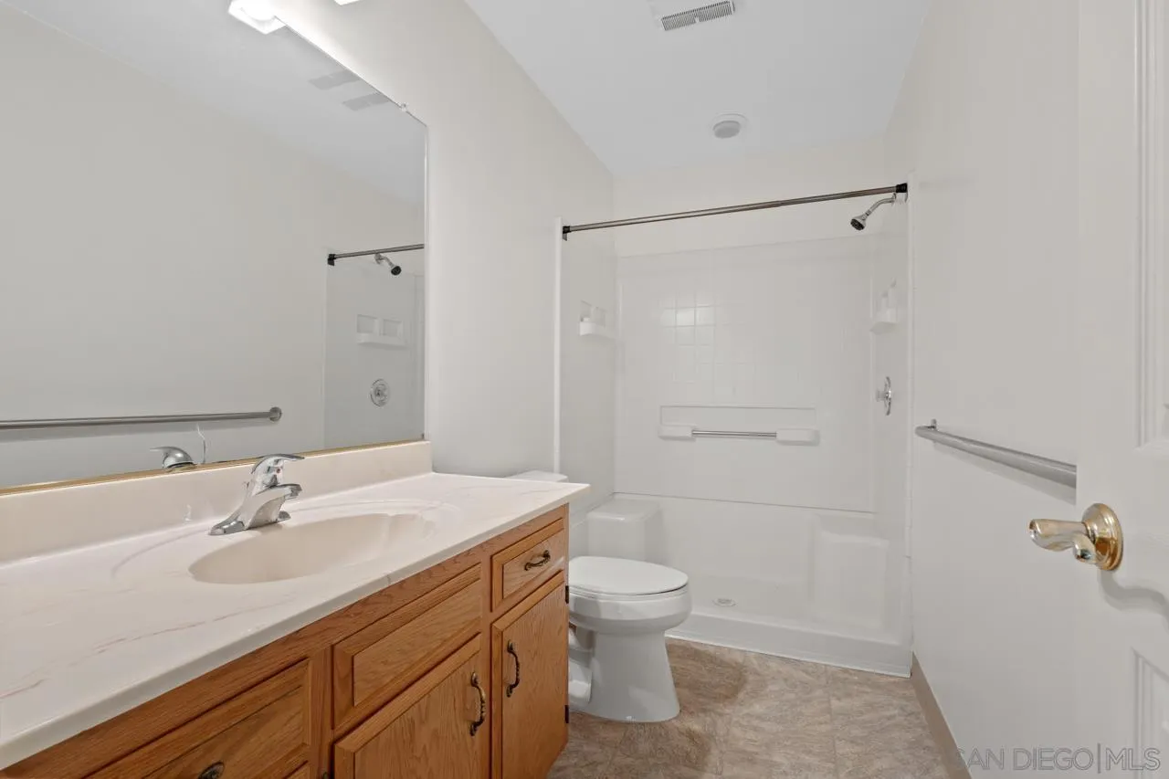 1346 El Nido Drive Fallbrook, CA 92028 - Photo 56 of 75 a bathroom with a sink toilet and shower