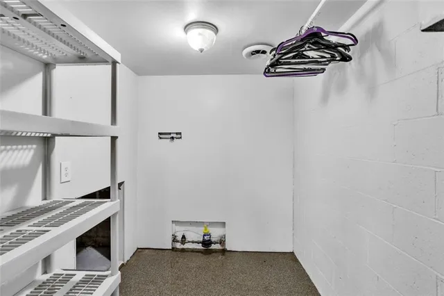 a view of storage and utility room with washer and dryer