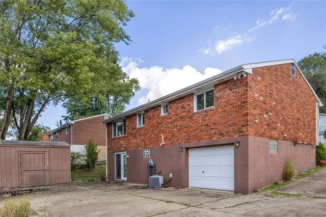 a front view of a house with a garage