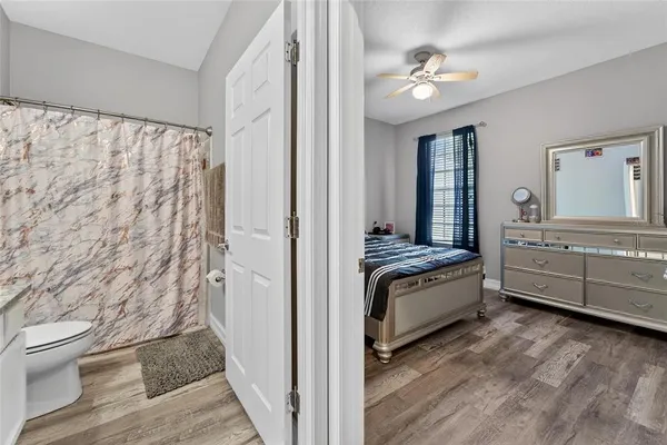 a kitchen with granite countertop a refrigerator and a sink