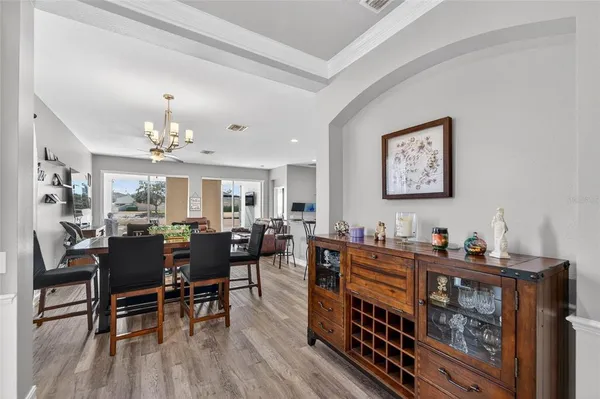 a view of a livingroom with furniture window and wooden floor