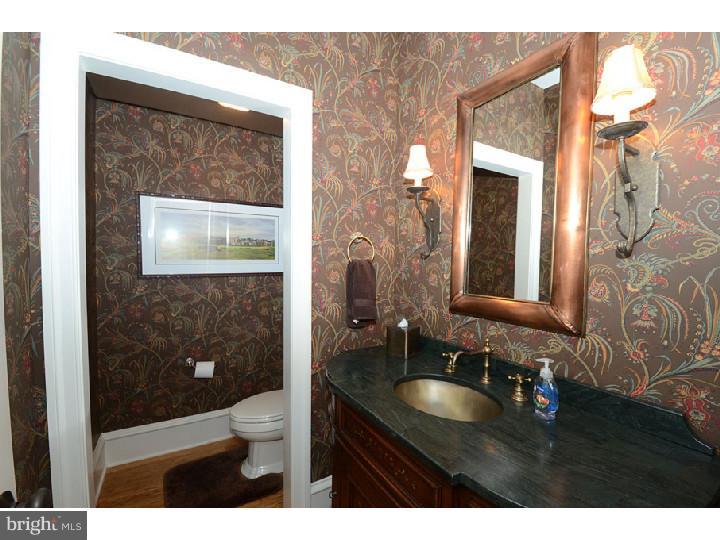 145 Sugartown Road Devon, PA 19333 - Photo 14 of 25 a bathroom with a sink and a mirror