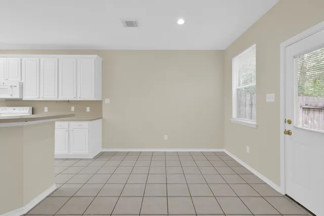 a view of an empty room with windows