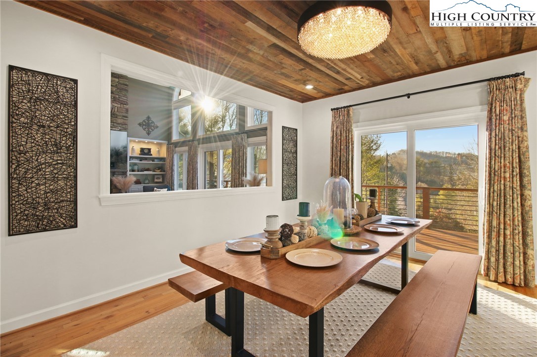 140 Gentry Road Boone, NC 28607 - Photo 21 of 49 a view of a dining room with furniture window and wooden floor