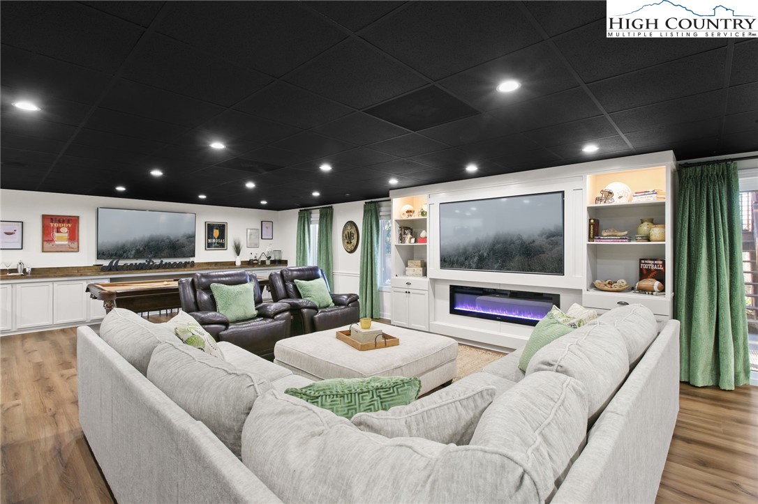 140 Gentry Road Boone, NC 28607 - Photo 30 of 49 a living room with furniture and a flat screen tv