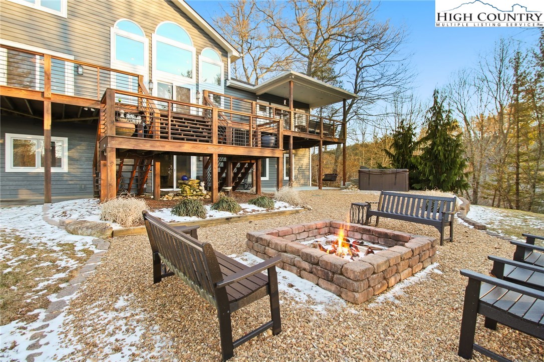 140 Gentry Road Boone, NC 28607 - Photo 3 of 49 a view of a patio with couches table and chairs and potted plants