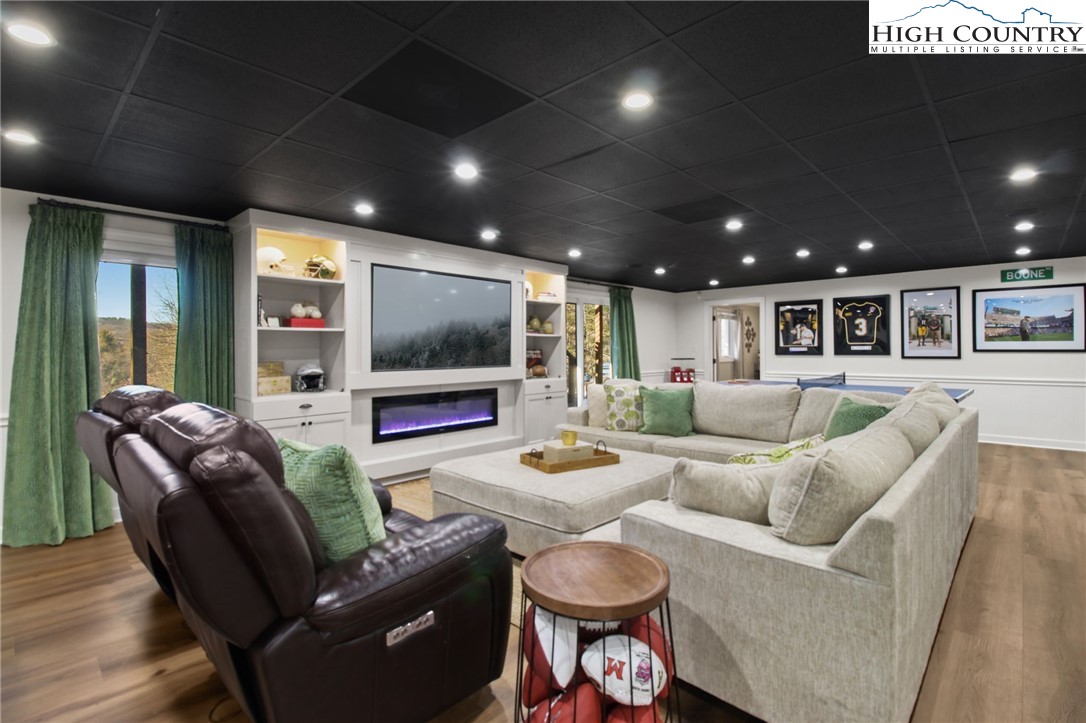 140 Gentry Road Boone, NC 28607 - Photo 34 of 49 a living room with furniture and a flat screen tv