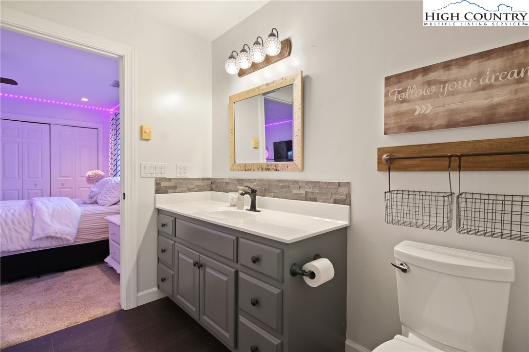 140 Gentry Road Boone, NC 28607 - Photo 39 of 49 a bathroom with a sink vanity tub and toilet