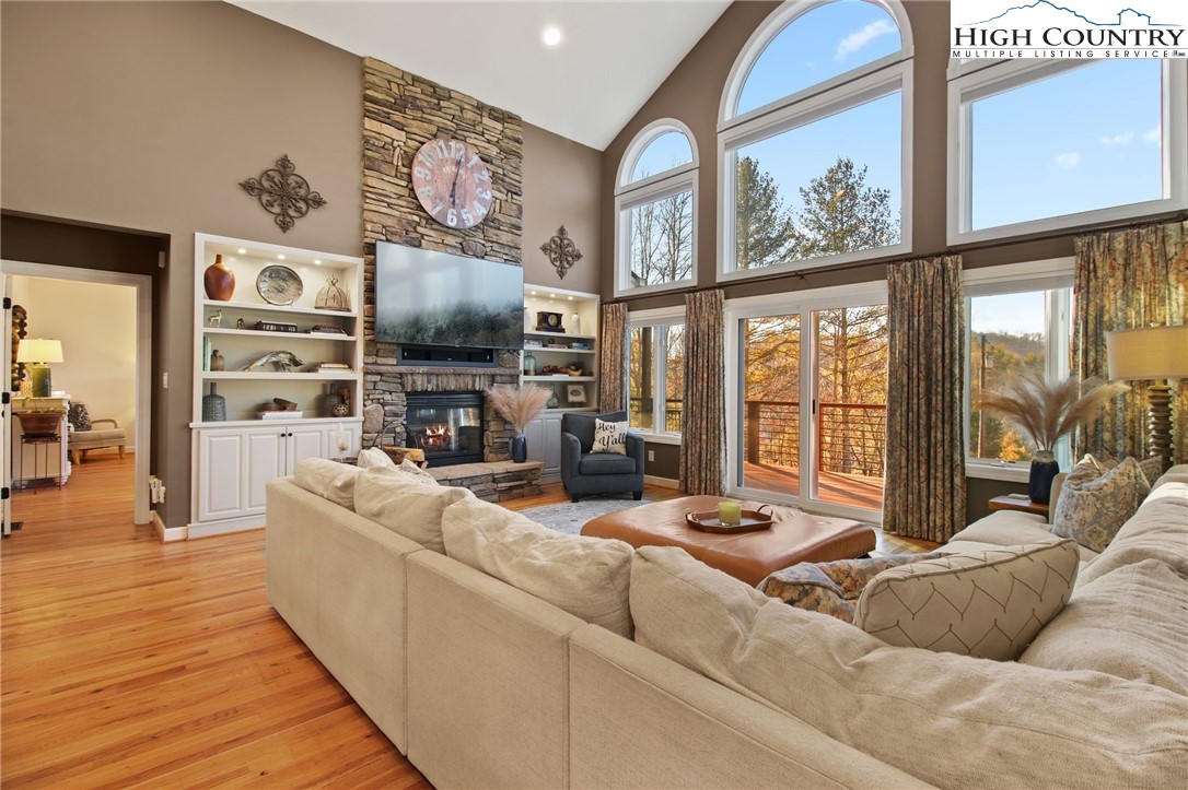 140 Gentry Road Boone, NC 28607 - Photo 7 of 49 a living room with fireplace furniture and a flat screen tv
