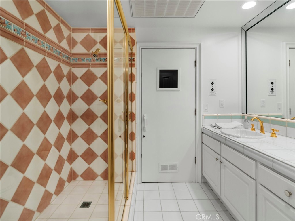 6000 Cavalleri Road Malibu, CA 90265 - Photo 30 of 44 a view of a bathroom with a sink and mirror
