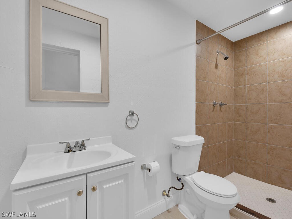 915 Alderman Street Fort Myers, FL 33916 - Photo 13 of 20 a bathroom with a sink toilet and vanity