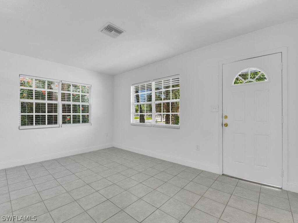 915 Alderman Street Fort Myers, FL 33916 - Photo 3 of 20 an empty room with windows