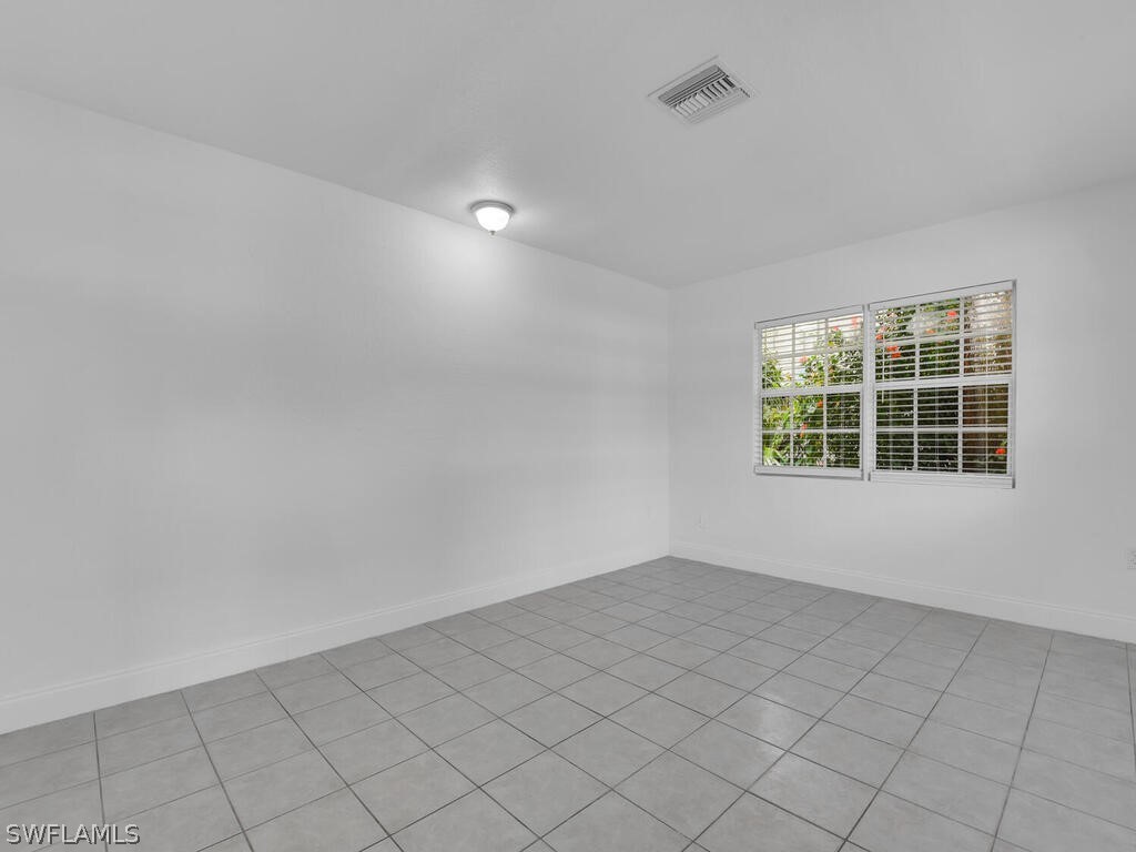 915 Alderman Street Fort Myers, FL 33916 - Photo 4 of 20 an empty room with windows