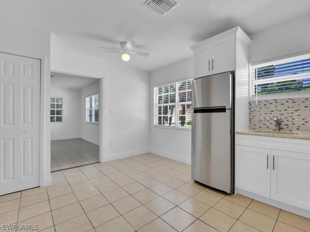 915 Alderman Street Fort Myers, FL 33916 - Photo 8 of 20 a view of kitchen with furniture and refrigerator