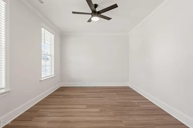 a bathroom with a shower sink vanity mirror and toilet