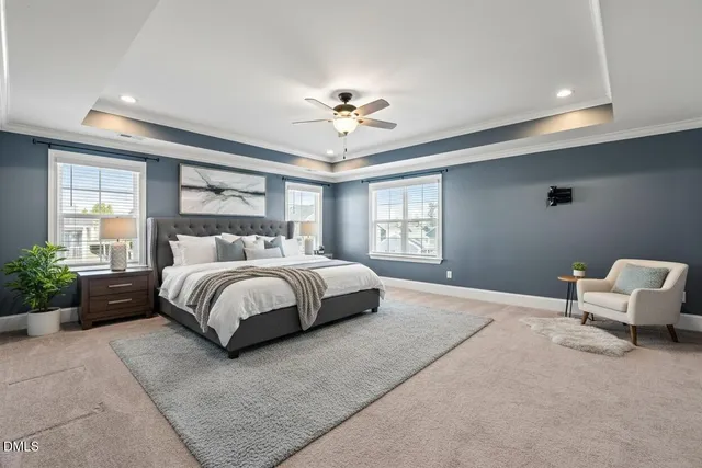 a view of an empty room with wooden floor fireplace and a window