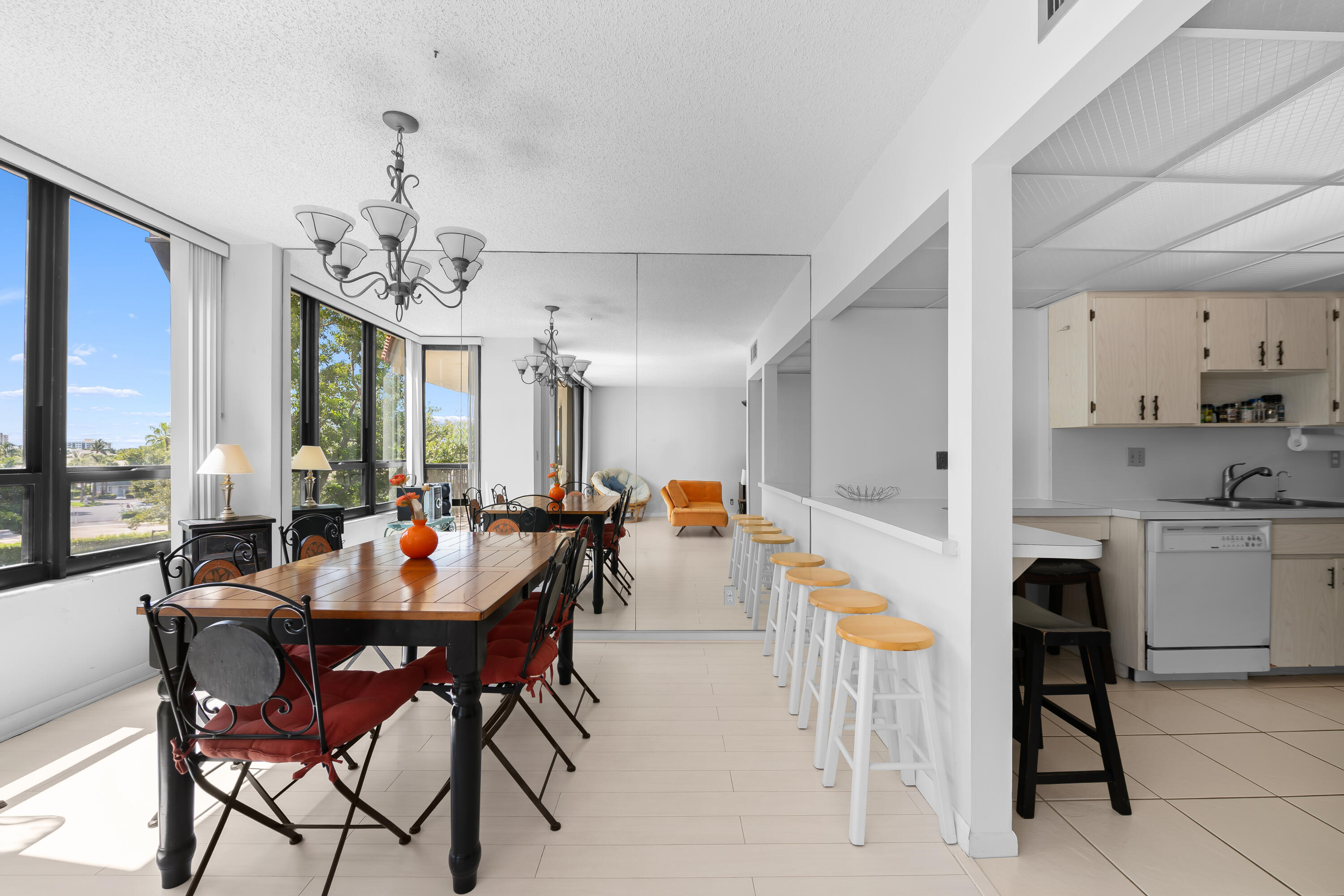 799 Jeffery Street, Unit 411 Boca Raton, FL 33487 - Photo 12 of 37 a view of a dining room with furniture and chandelier