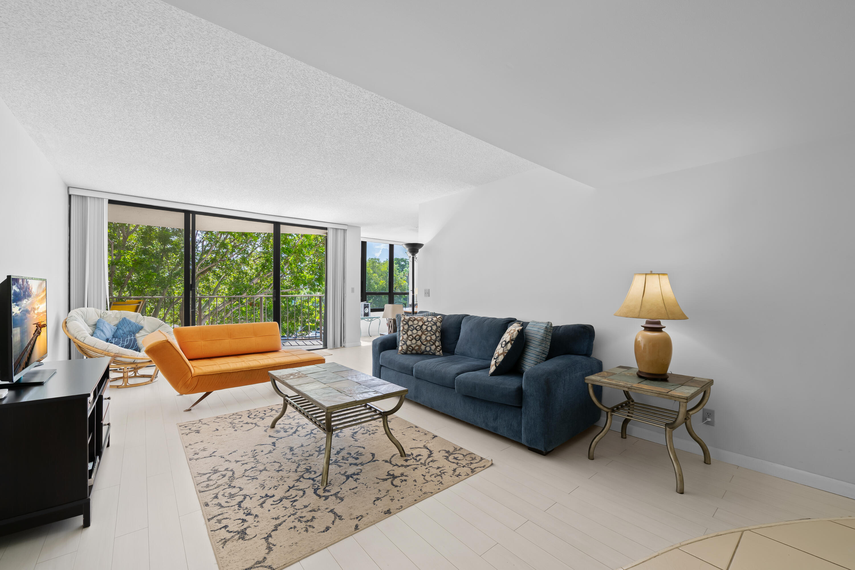 799 Jeffery Street, Unit 411 Boca Raton, FL 33487 - Photo 15 of 37 a living room with furniture and a large window