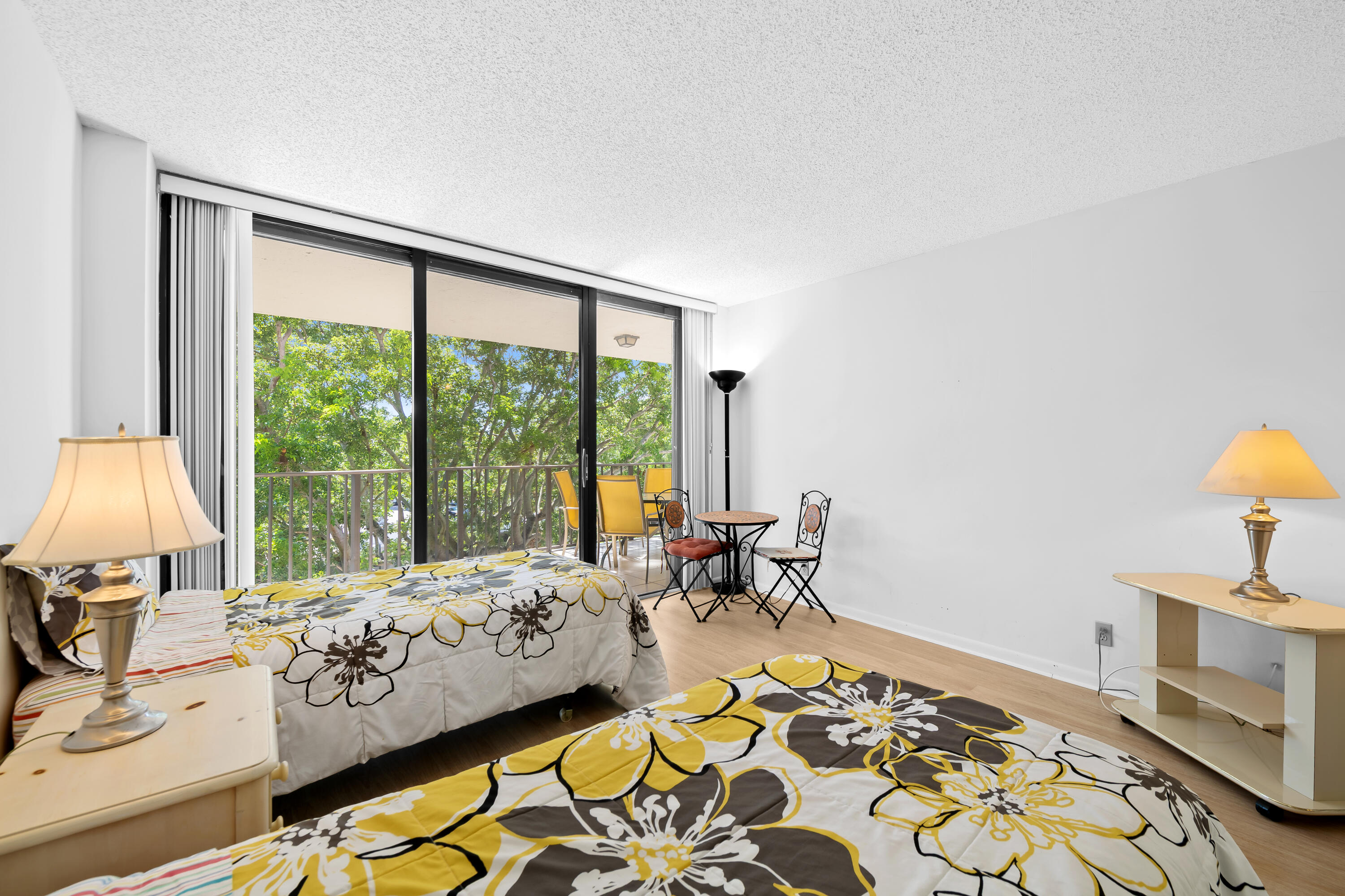 799 Jeffery Street, Unit 411 Boca Raton, FL 33487 - Photo 17 of 37 a bedroom with furniture and a large window