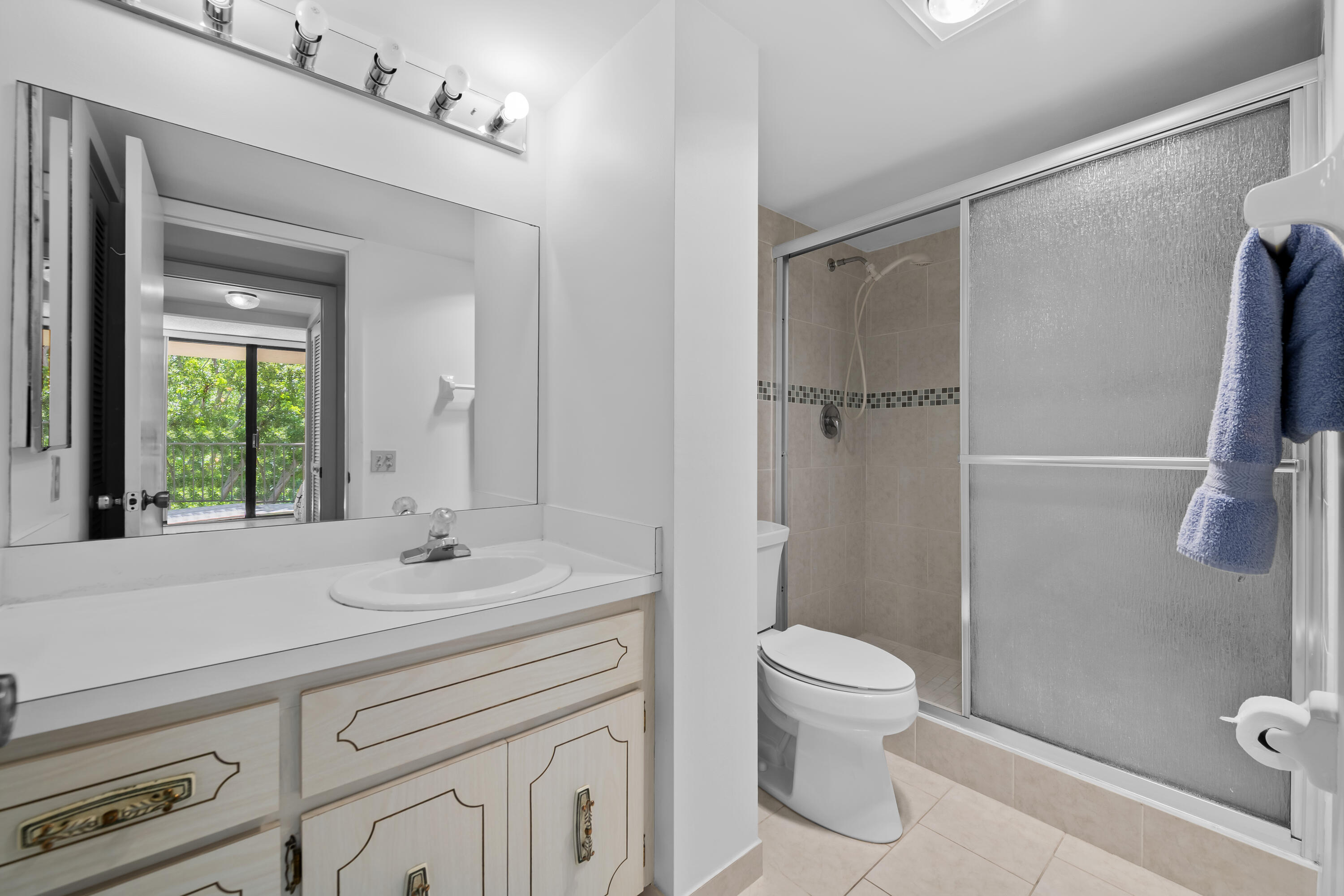 799 Jeffery Street, Unit 411 Boca Raton, FL 33487 - Photo 18 of 37 a bathroom with a sink a toilet and shower