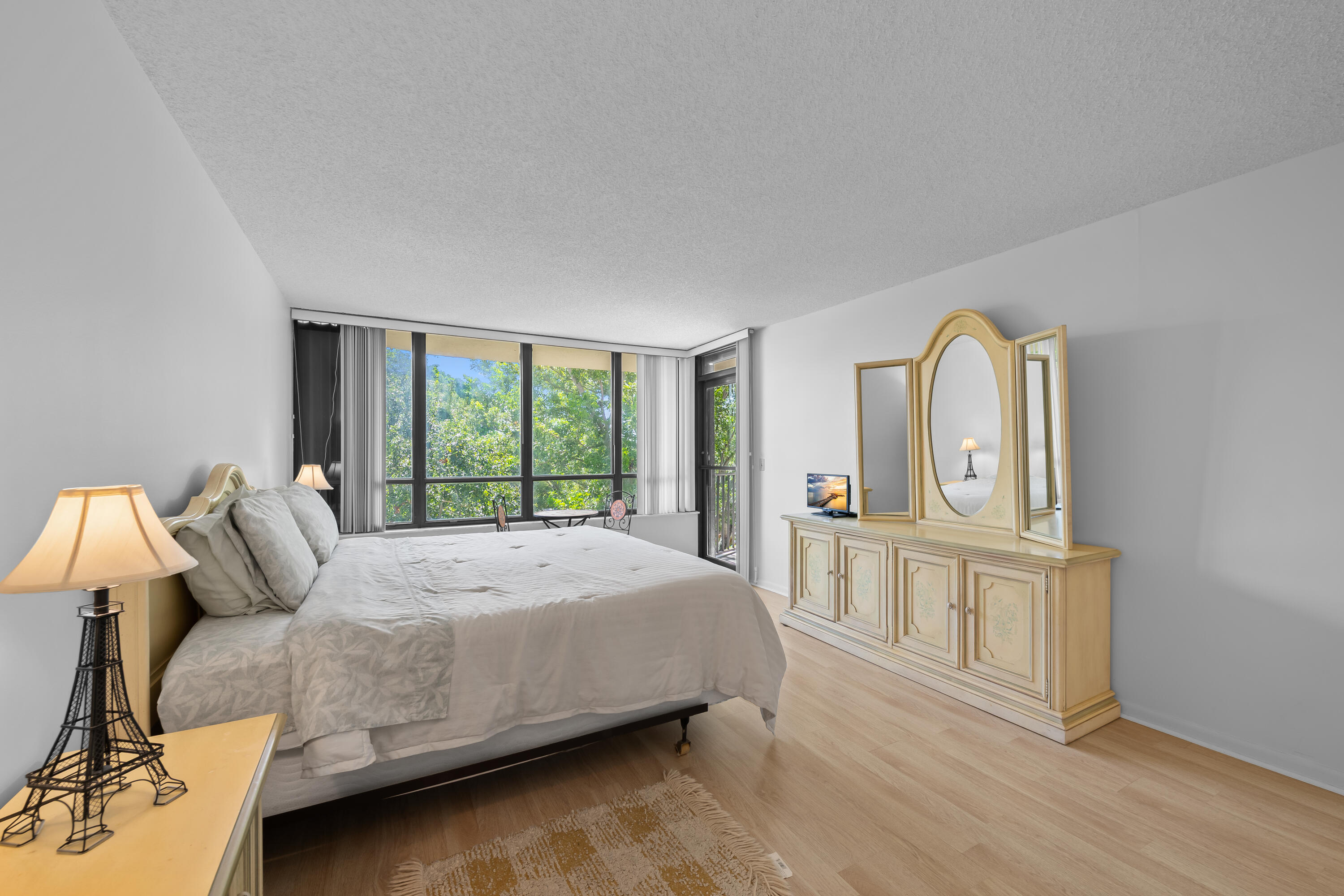 799 Jeffery Street, Unit 411 Boca Raton, FL 33487 - Photo 19 of 37 a bedroom with a large bed and a window