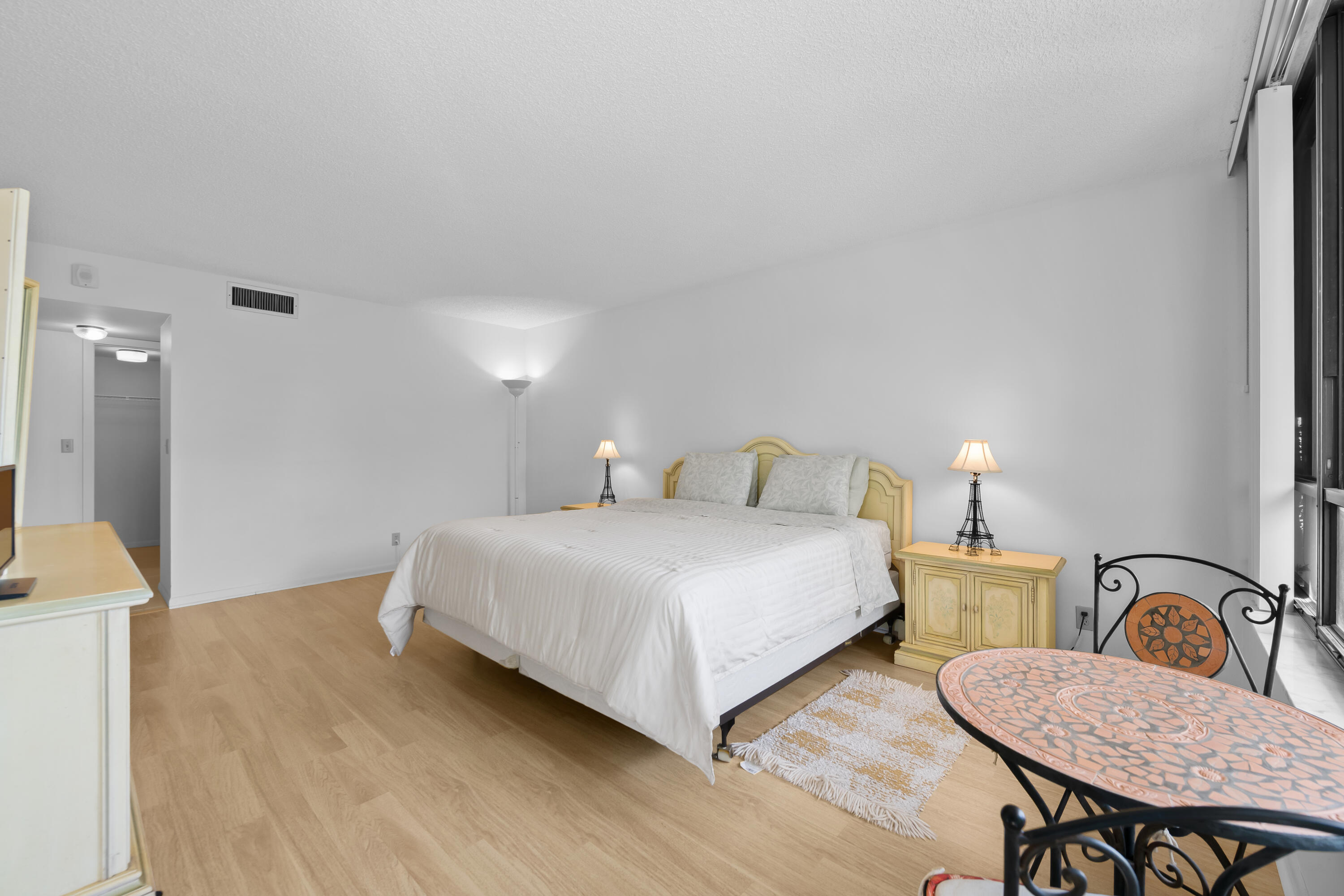 799 Jeffery Street, Unit 411 Boca Raton, FL 33487 - Photo 20 of 37 a bedroom with two beds and a table