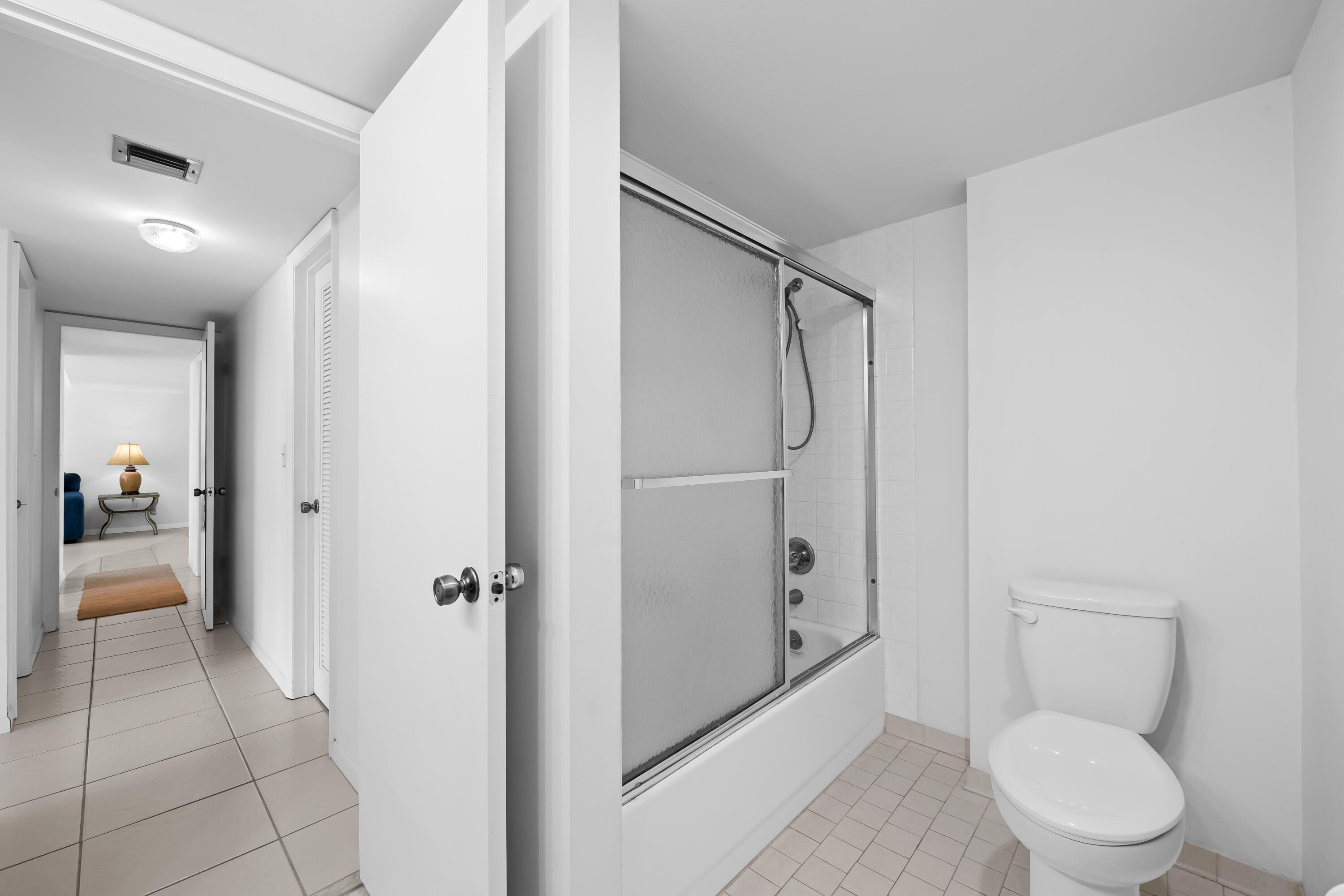 799 Jeffery Street, Unit 411 Boca Raton, FL 33487 - Photo 24 of 37 a bathroom with a toilet a sink and shower