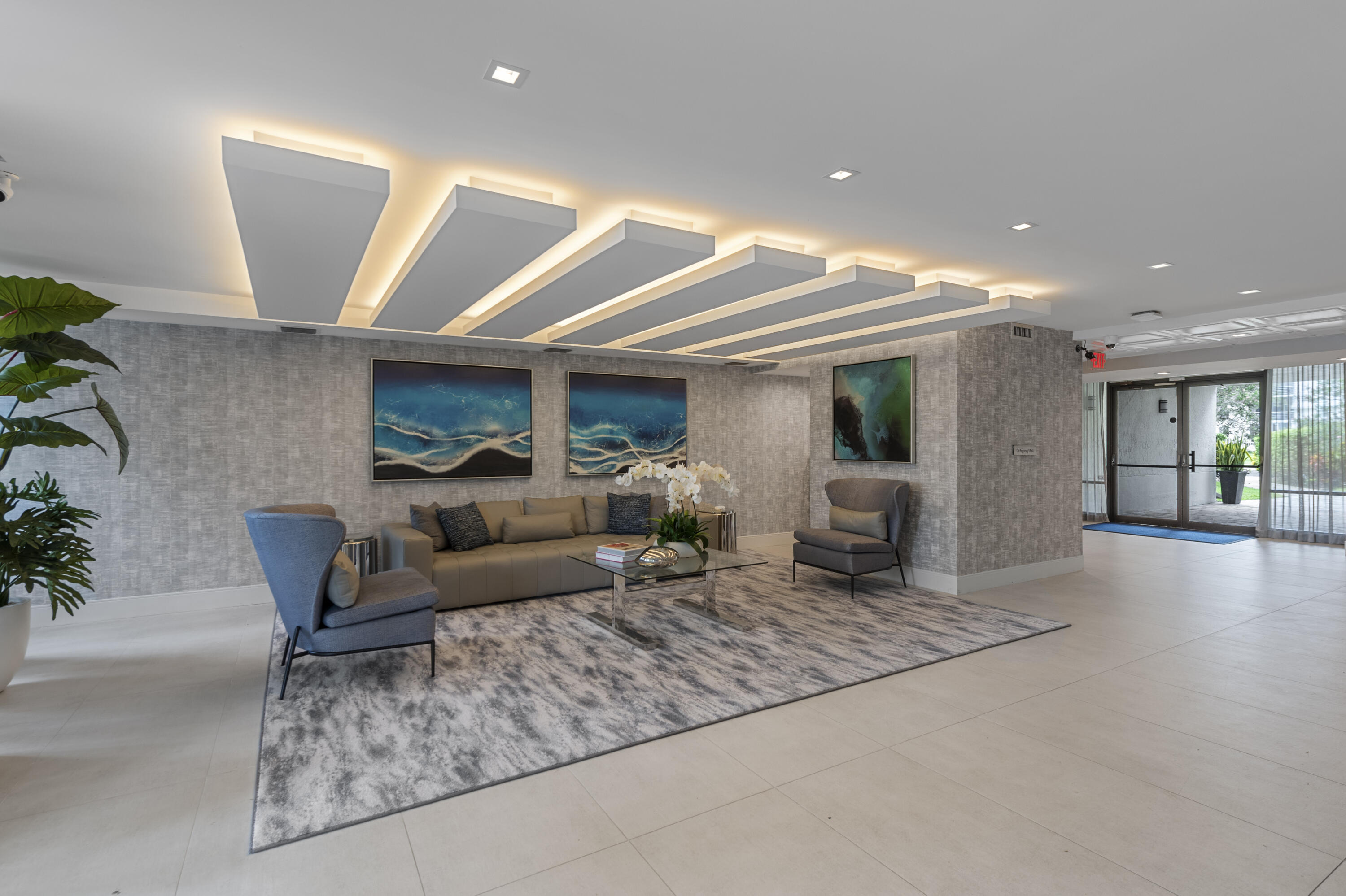 799 Jeffery Street, Unit 411 Boca Raton, FL 33487 - Photo 26 of 37 a living room with furniture and a wooden floor