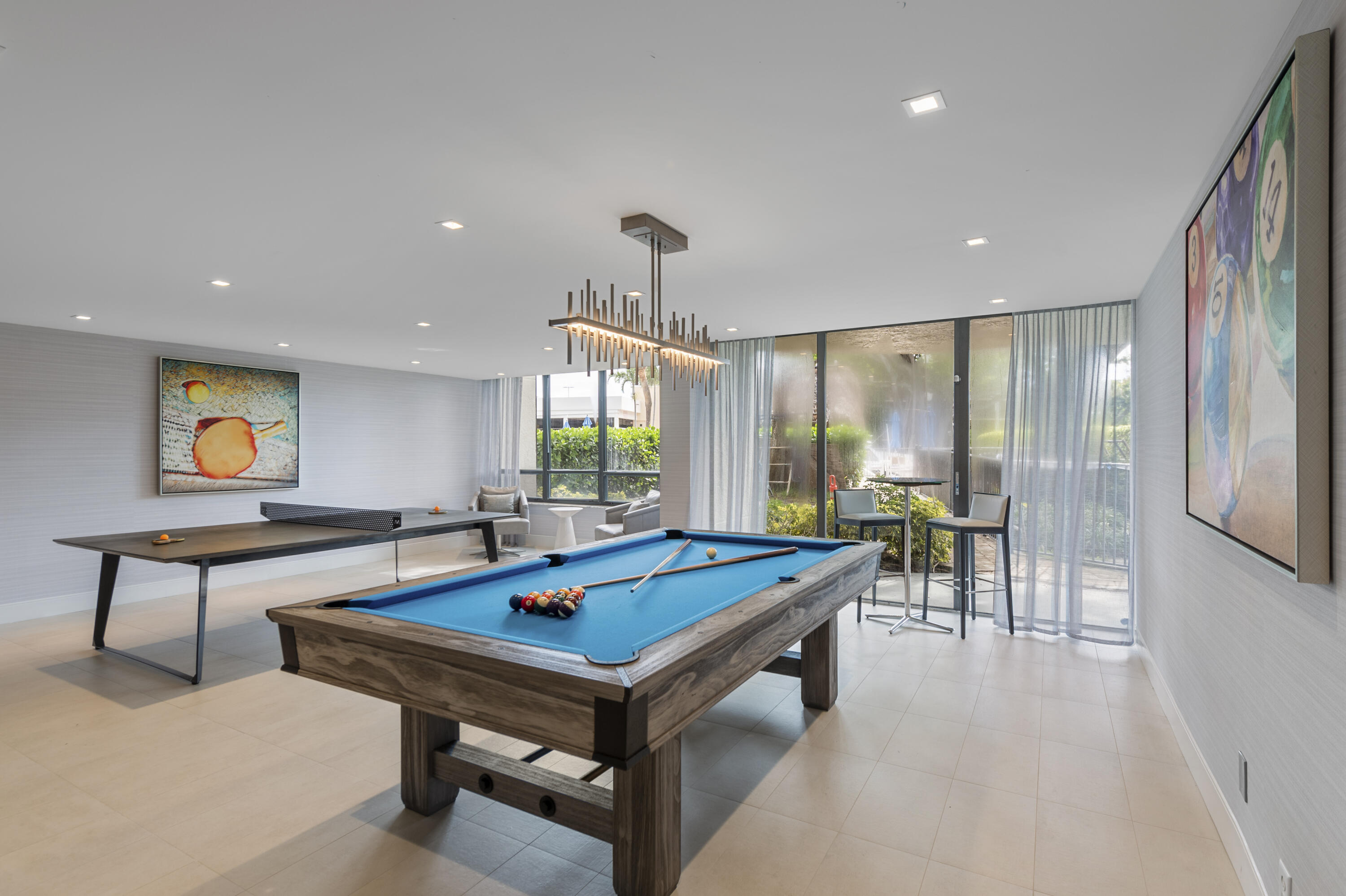 799 Jeffery Street, Unit 411 Boca Raton, FL 33487 - Photo 30 of 37 a living room with furniture pool table and a table