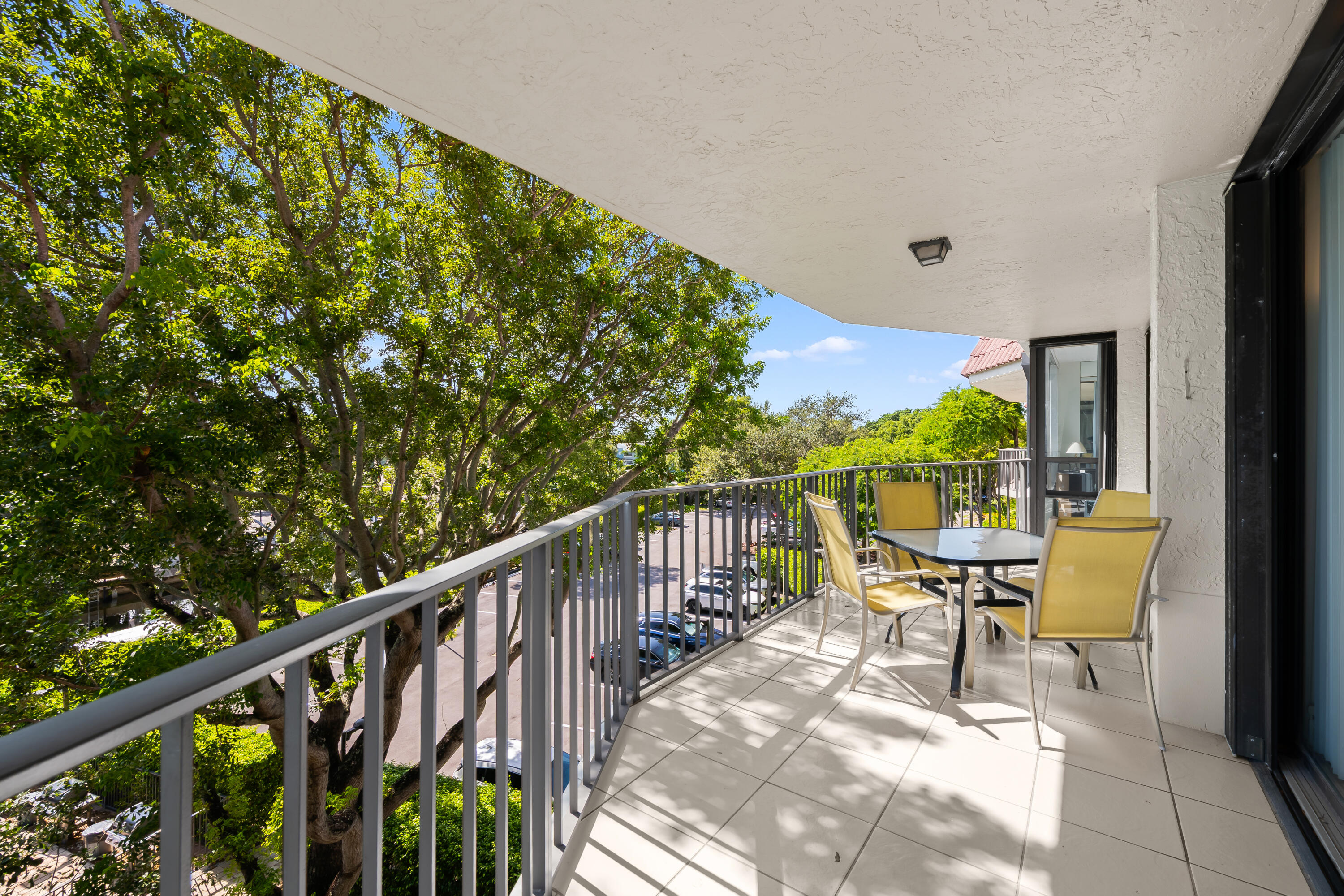 799 Jeffery Street, Unit 411 Boca Raton, FL 33487 - Photo 3 of 37 a view of a chairs and table in the balcony