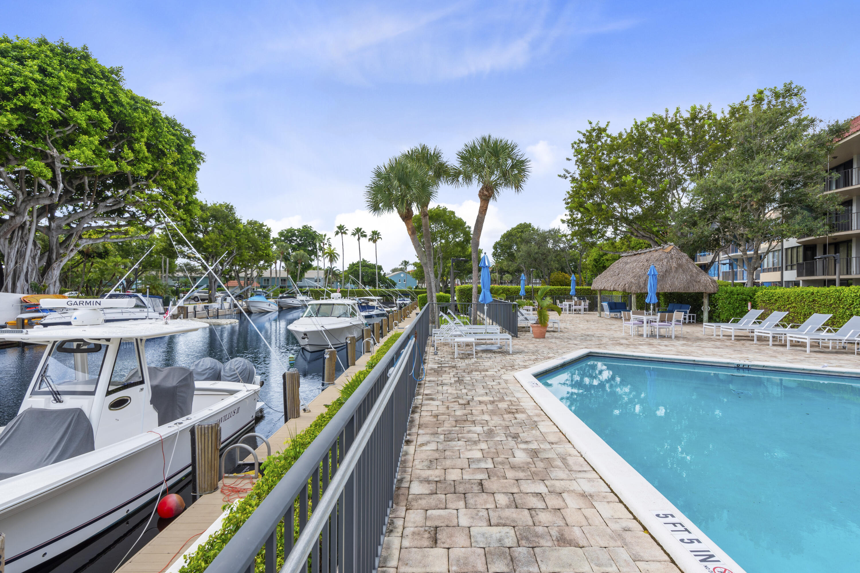 799 Jeffery Street, Unit 411 Boca Raton, FL 33487 - Photo 34 of 37 a view of a swimming pool with a patio