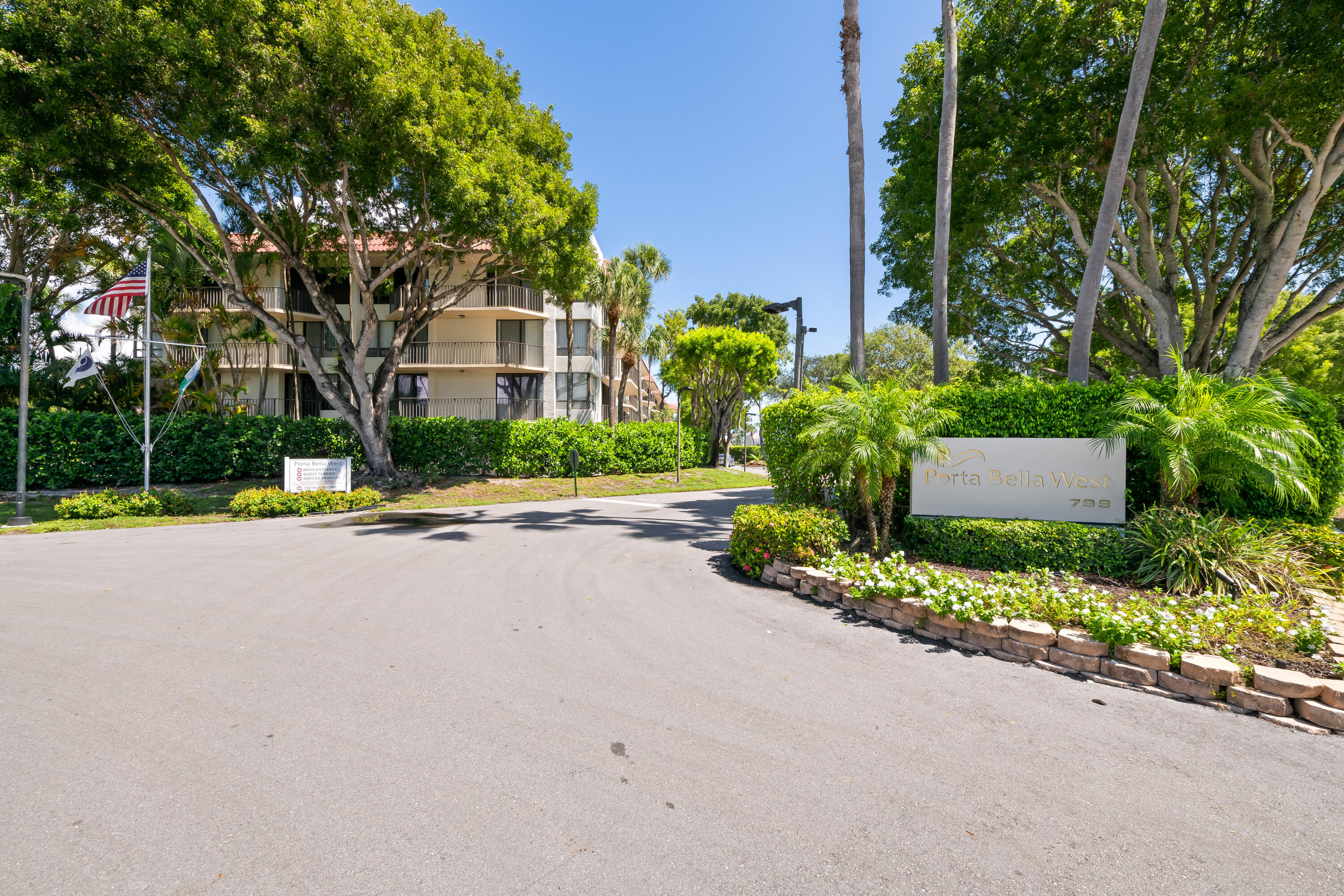 799 Jeffery Street, Unit 411 Boca Raton, FL 33487 - Photo 36 of 37 a house with a yard and a large trees