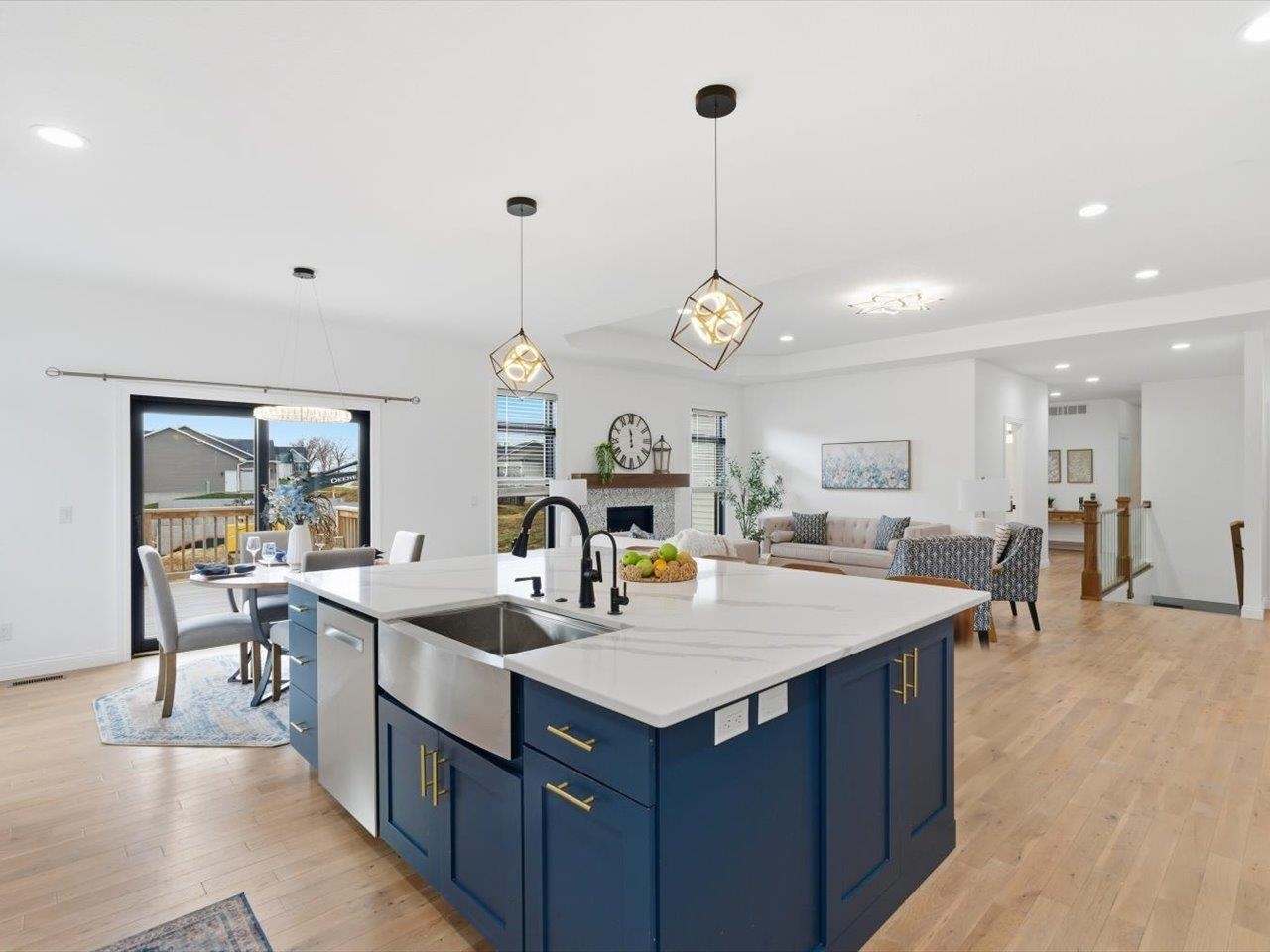 6817 Timber Court Bettendorf, IA 52722 - Photo 14 of 64 a large kitchen with kitchen island a island a sink a stove and a table