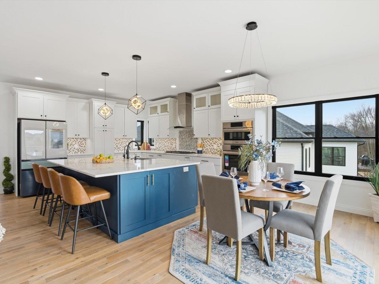 6817 Timber Court Bettendorf, IA 52722 - Photo 18 of 64 a view of a dining room with furniture window and wooden floor
