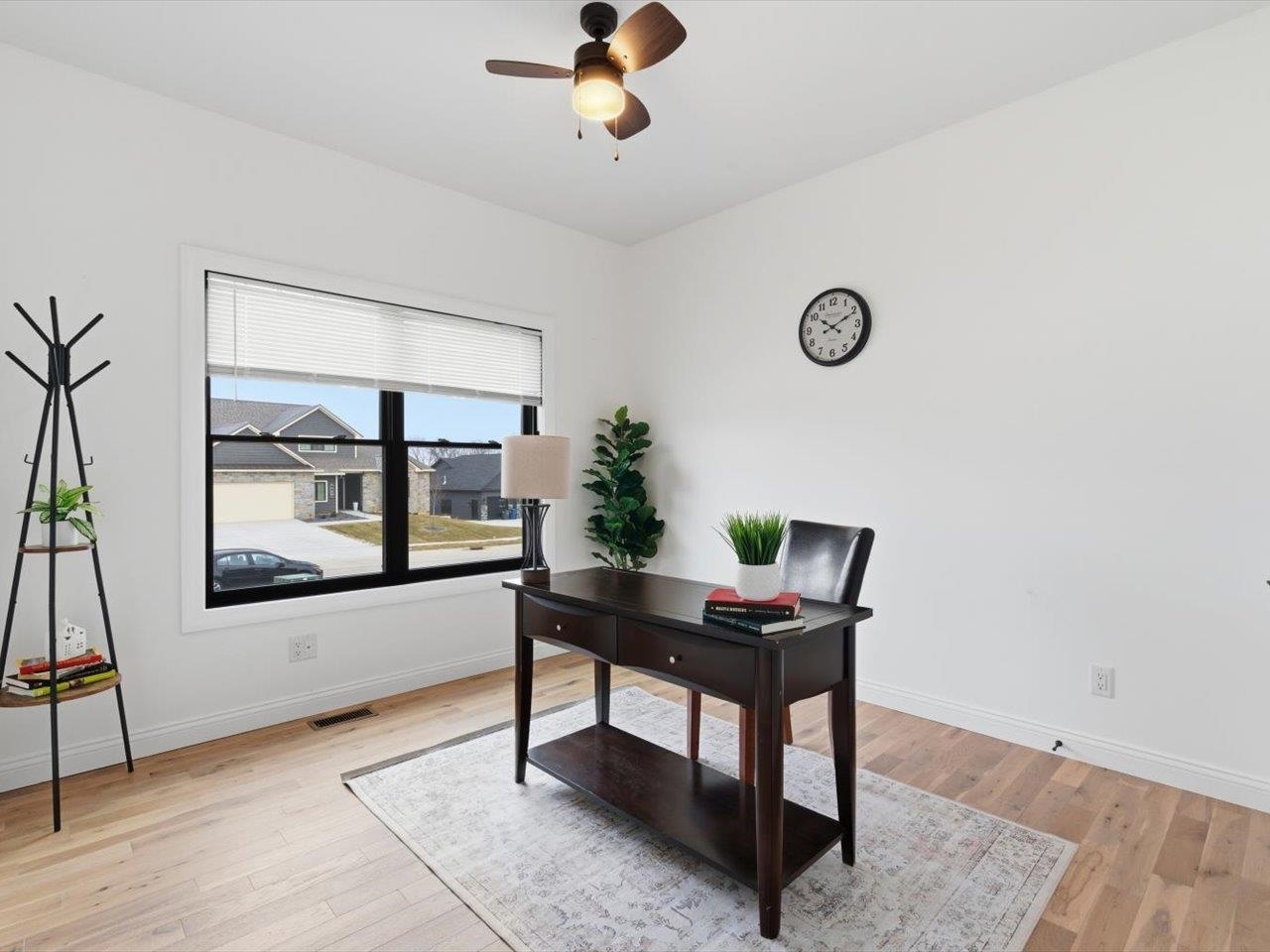6817 Timber Court Bettendorf, IA 52722 - Photo 22 of 64 a workspace with furniture window and wooden floor