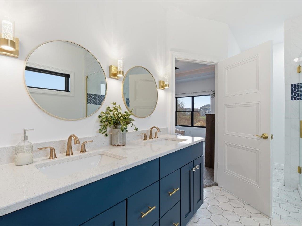 6817 Timber Court Bettendorf, IA 52722 - Photo 31 of 64 a bathroom with a double vanity sink and a mirror