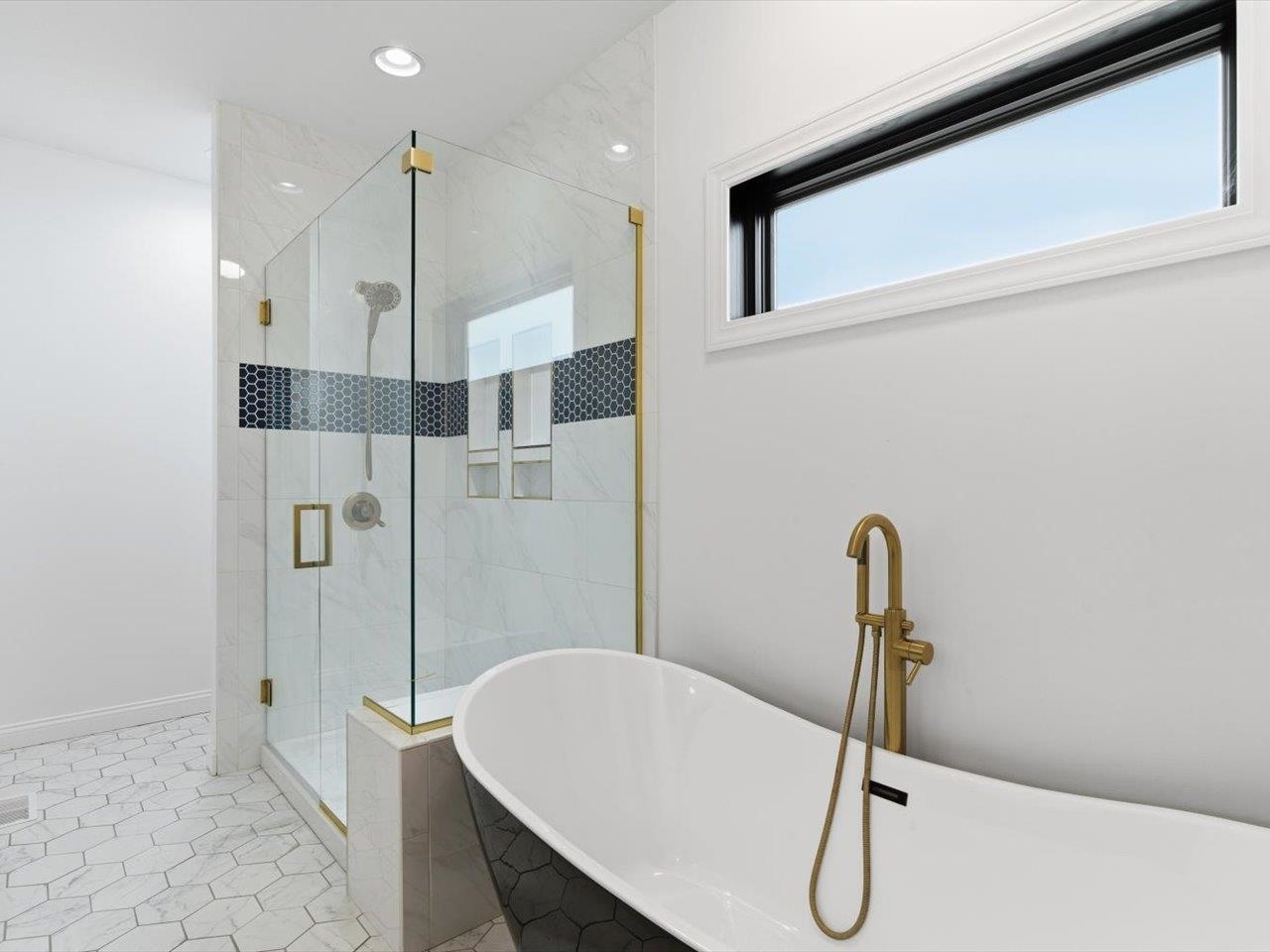 6817 Timber Court Bettendorf, IA 52722 - Photo 34 of 64 a bathroom with a shower and a bath tub