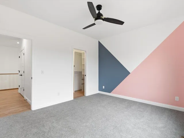 an empty room with a empty space and windows