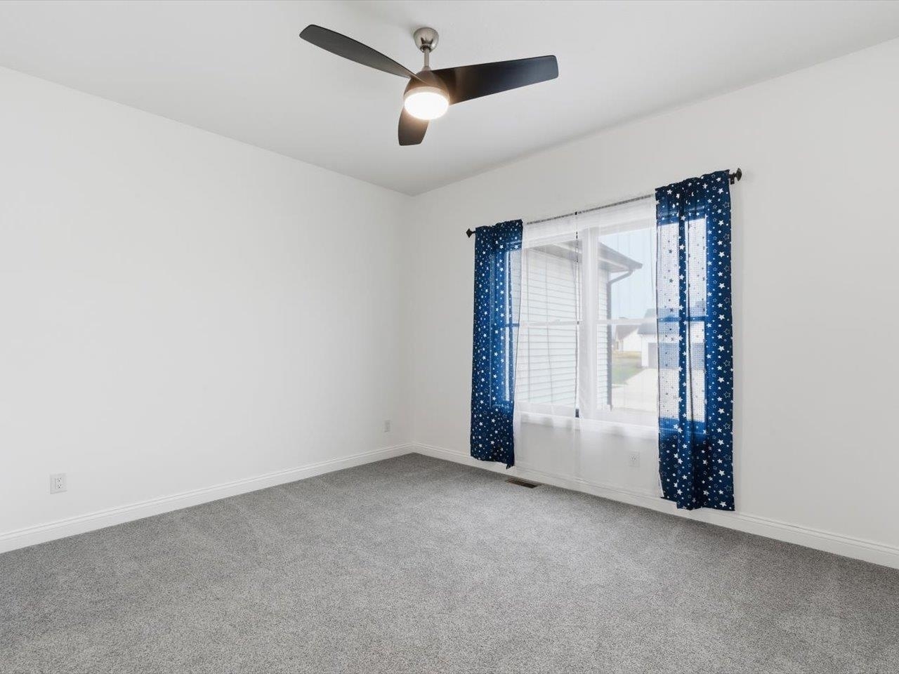 6817 Timber Court Bettendorf, IA 52722 - Photo 39 of 64 an empty room with closet and windows