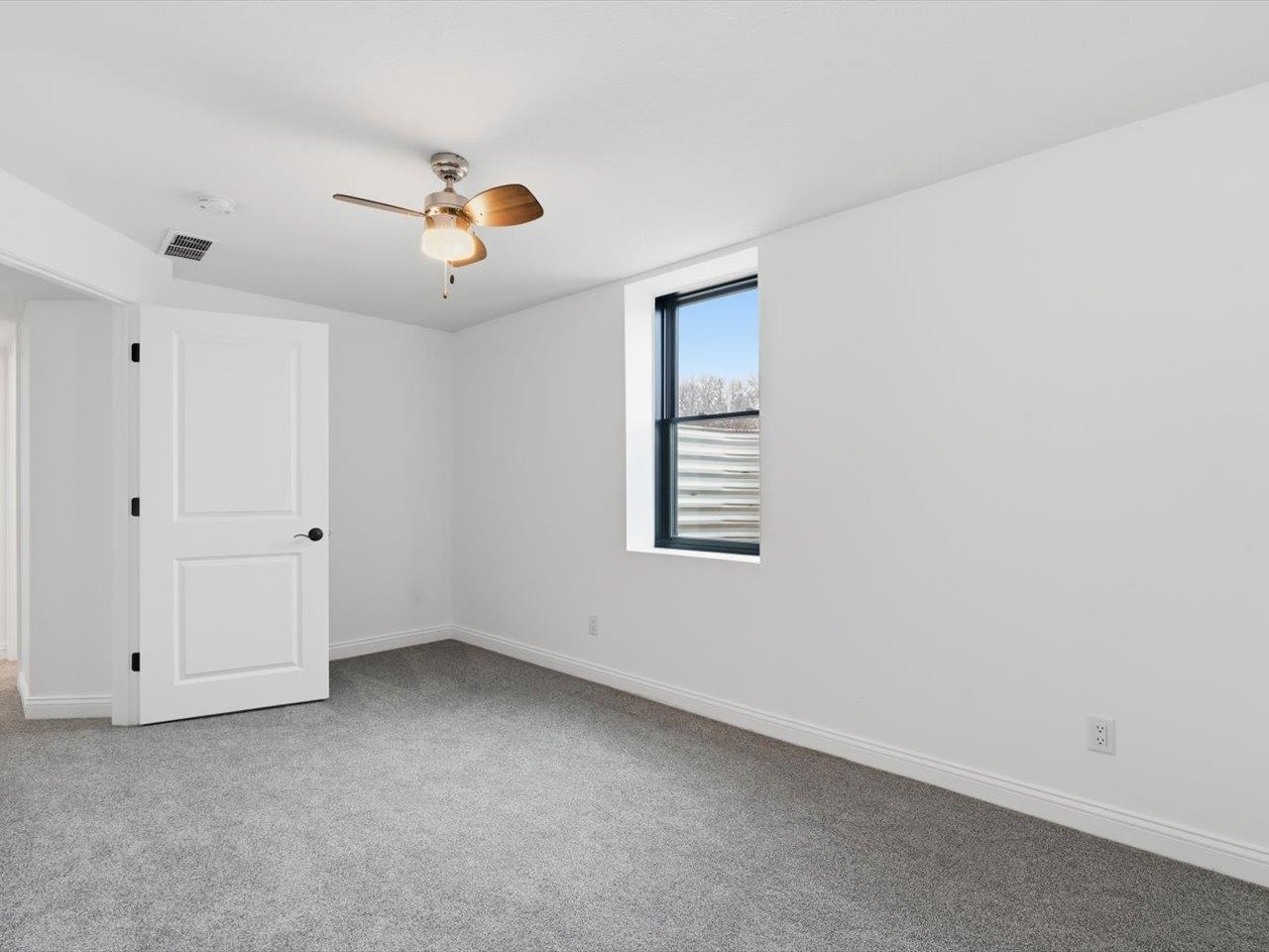 6817 Timber Court Bettendorf, IA 52722 - Photo 48 of 64 a view of an empty room with a window
