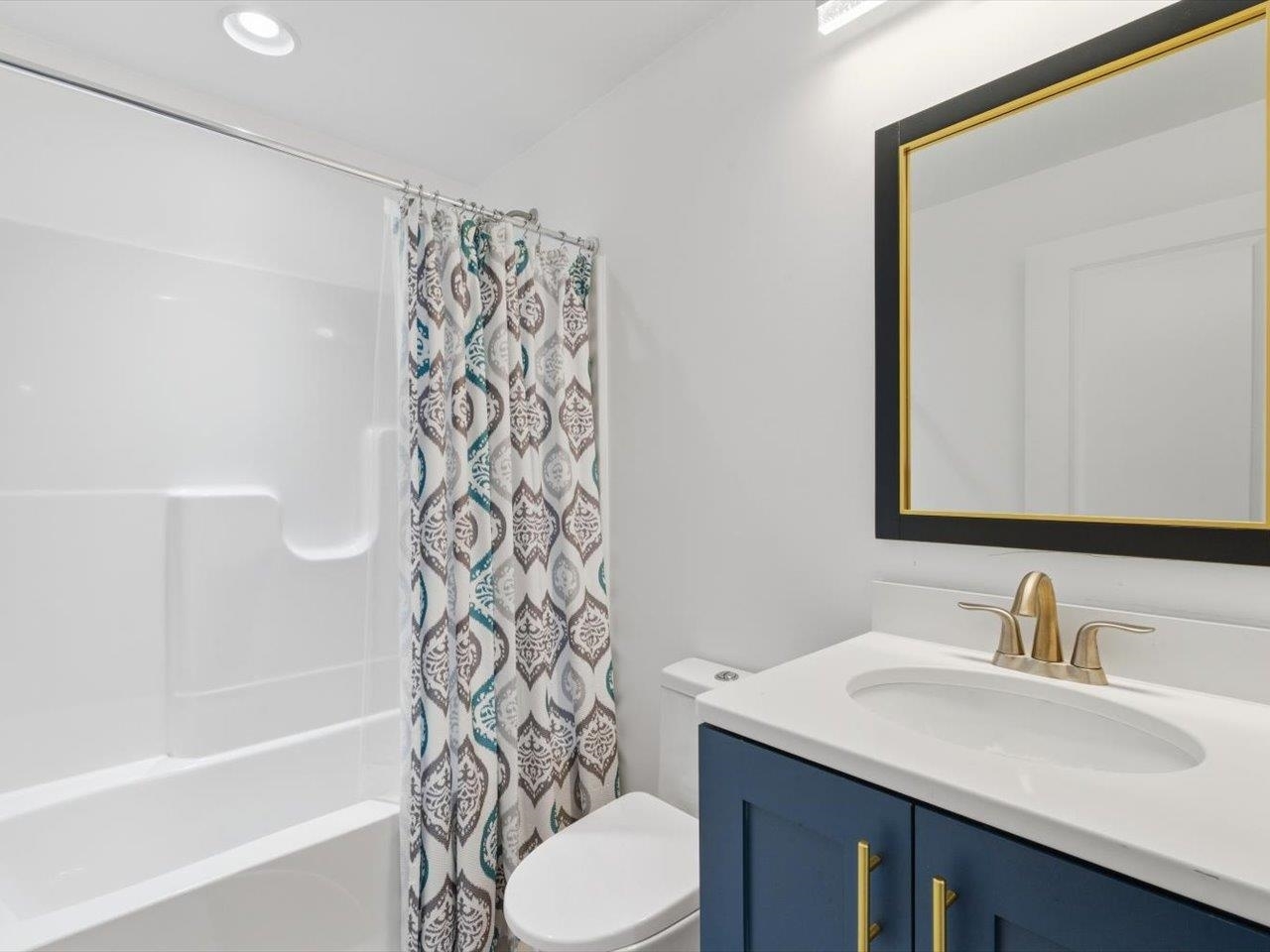 6817 Timber Court Bettendorf, IA 52722 - Photo 50 of 64 a bathroom with a sink toilet and shower