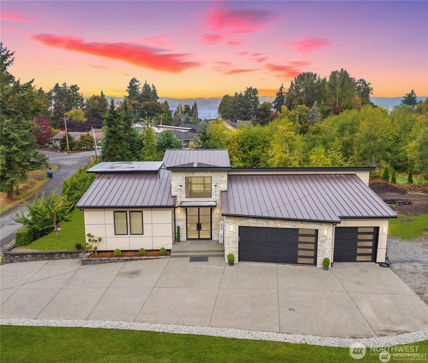 30404 28th Avenue Southwest Federal Way, WA 98023 - Photo 1 of 24 a front view of a house with a garden and trees