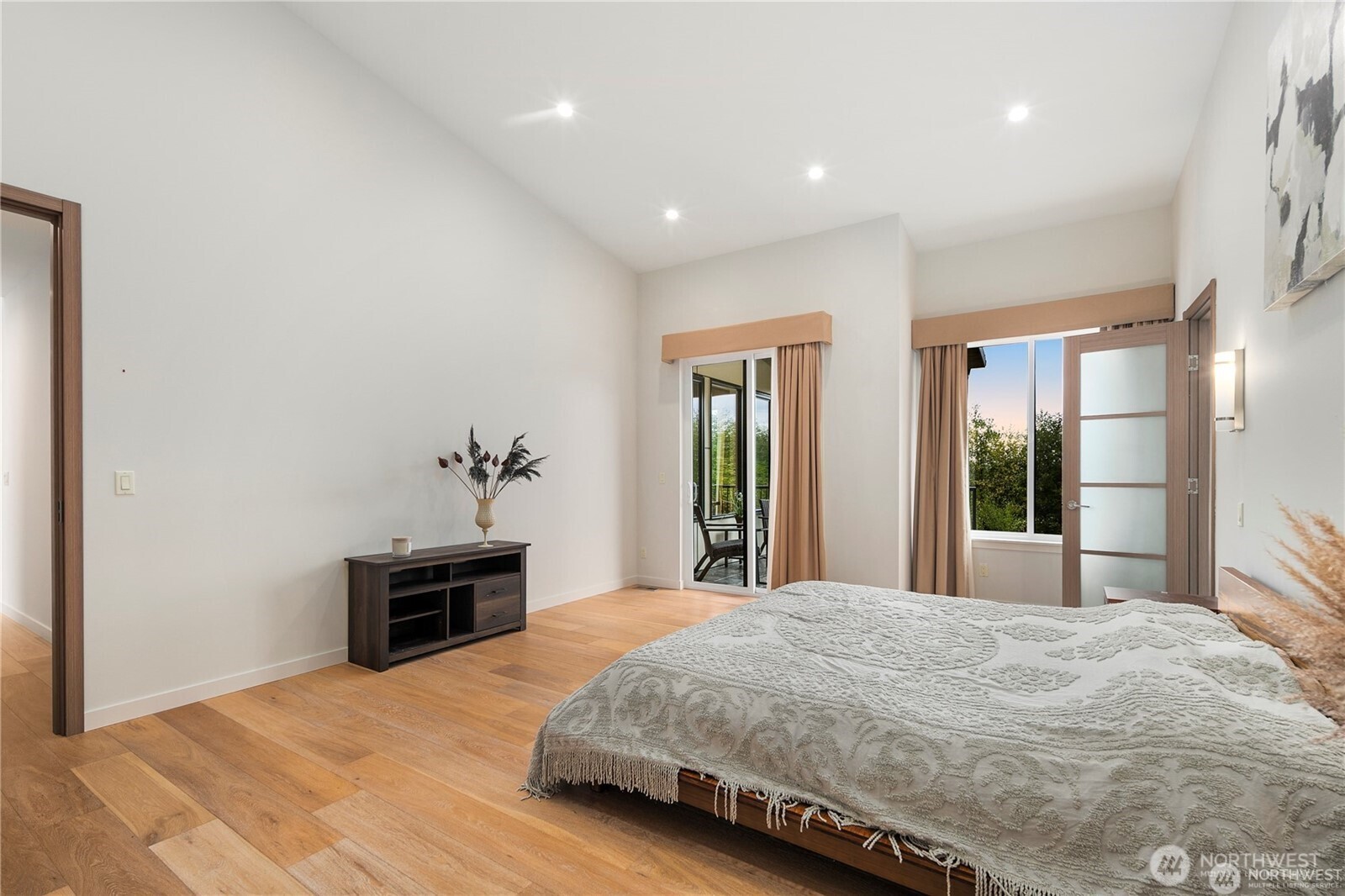 30404 28th Avenue Southwest Federal Way, WA 98023 - Photo 18 of 24 a spacious bedroom with a large bed and a chandelier