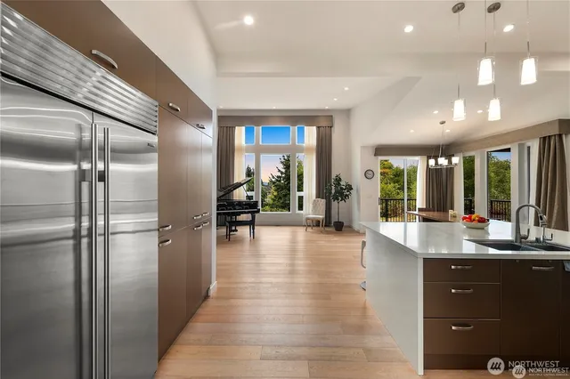 a kitchen with a sink stove and wooden cabinets